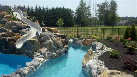 Large Pool With Boulder Waterfall Water Slide And A Lazy River