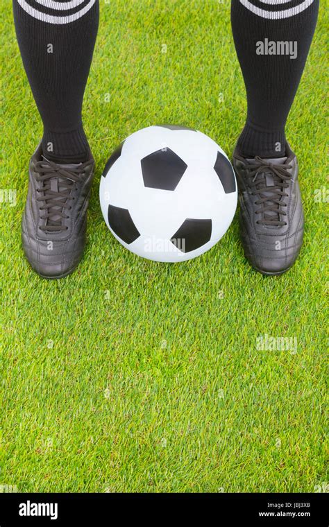 Soccer Players Feet And Football On Field Stock Photo Alamy