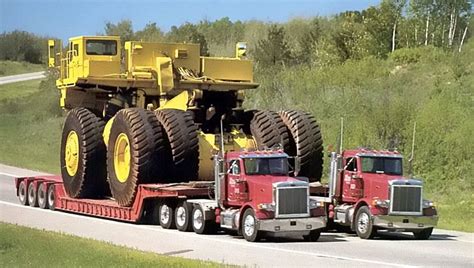 Witnessing The Unison Of Two Trucks Carrying The Largest Excavator Worldwide Video