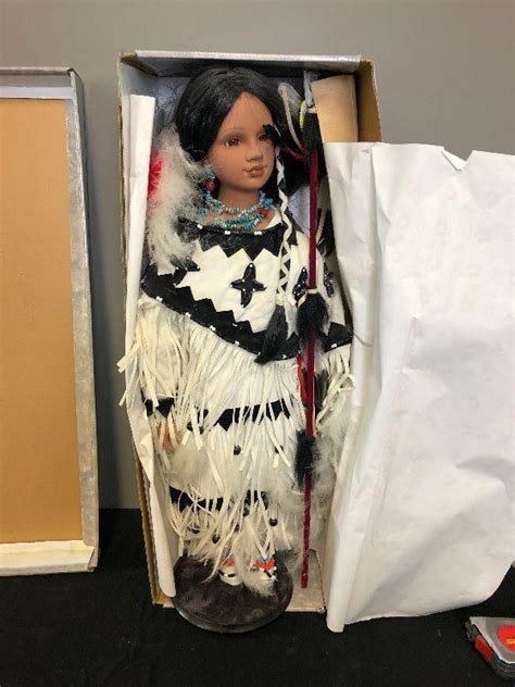 lot 198 native american porcelain doll with spear in white tradition dress