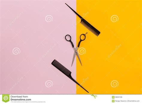 Barber Set With Two Combs And Scissors On Pink And Yellow Background