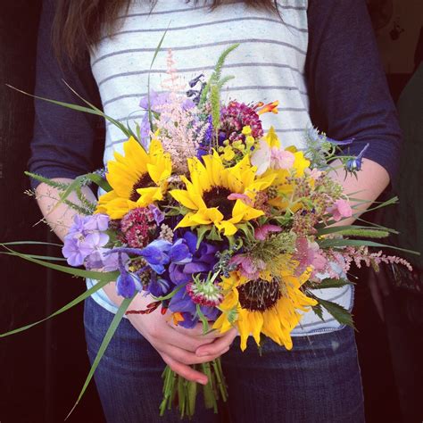 20 chic spring wedding flower ideas to steal asap. sunflower bouquet with purple flowers | Flower company ...