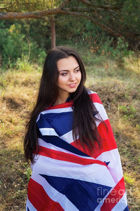 Young Beautiful Brunette Girl Posing With A British Flag In Autumn Park