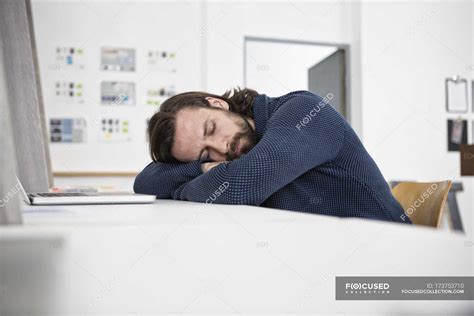Man Sleeping On Desk In Office — Overtime Entrepreneur Stock Photo