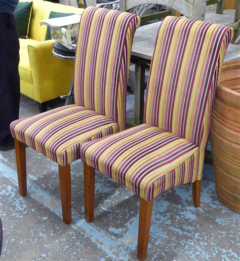 Gather around the table with comfortable dining room chairs. CONTEMPORARY DINING CHAIRS, a set of eight, with multi ...