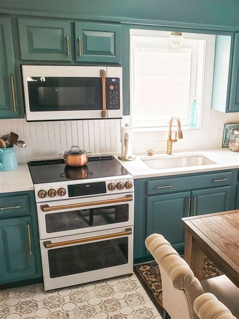 Blue cabinet colors—both light and dark—work well with white walls or, if you like the idea of going with various shades, contrast your blue cabinets with a different shade of blue on the walls. Cabinet color is Sherwin Williams Riverway SW6222; Appliances are GE Cafe in Matte White | Ge ...