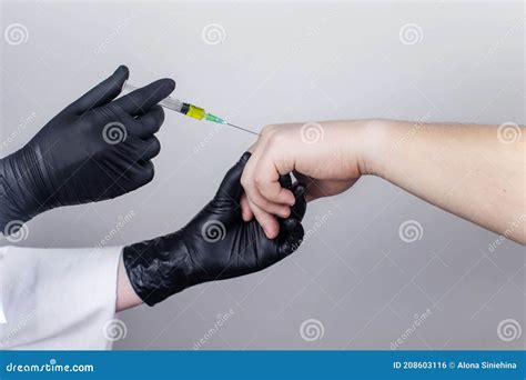 An Orthopedic Surgeon Gives An Injection In The Finger Joint Treatment