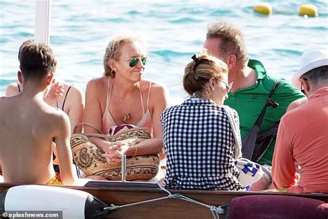 toni collette looks sensational in orange bikini as she cools off in italy while temperatures