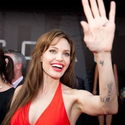 Her tattoos are mostly done in one tone black ink. Angelina Jolie Sexy Tattoos and their Meanings