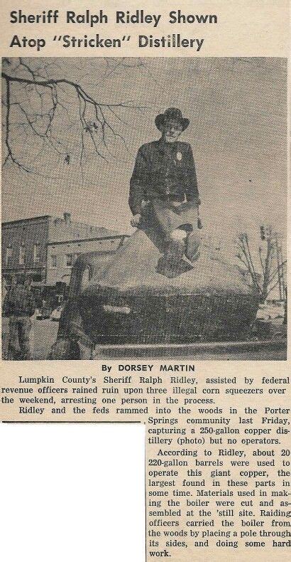 An Old Newspaper Article With A Photo Of A Man Standing On Top Of A Car