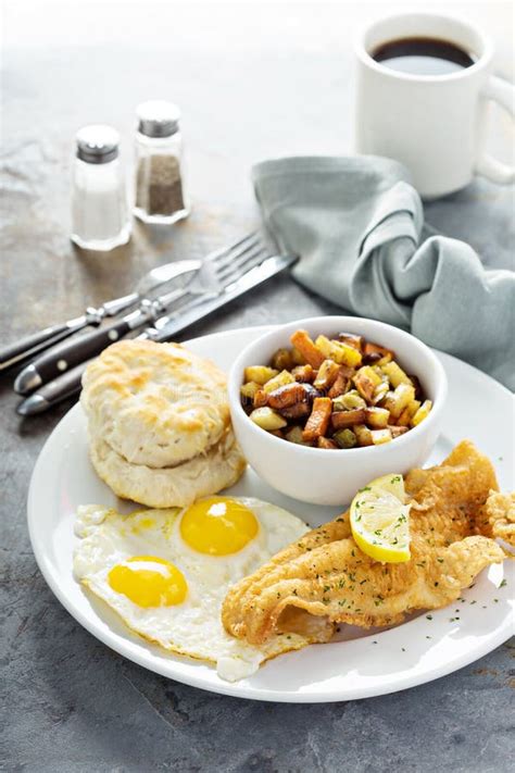Fried Fish Breakfast With Sunny Side Up Eggs Stock Photo Image Of