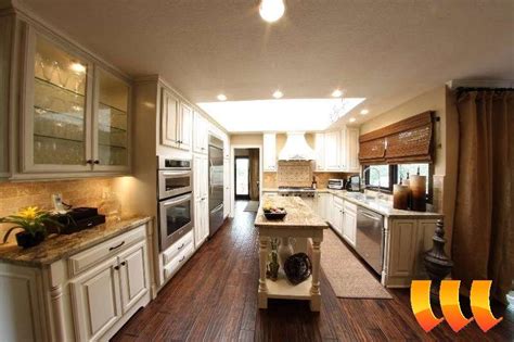 Make sure the flooring is not the … Combination of almond glazed cabinets dark wood floor and ...