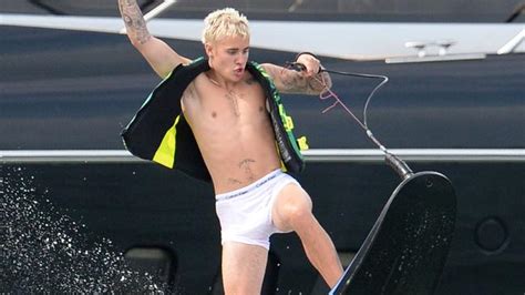 justin bieber goes wakeboarding in his white underwear photos the courier mail