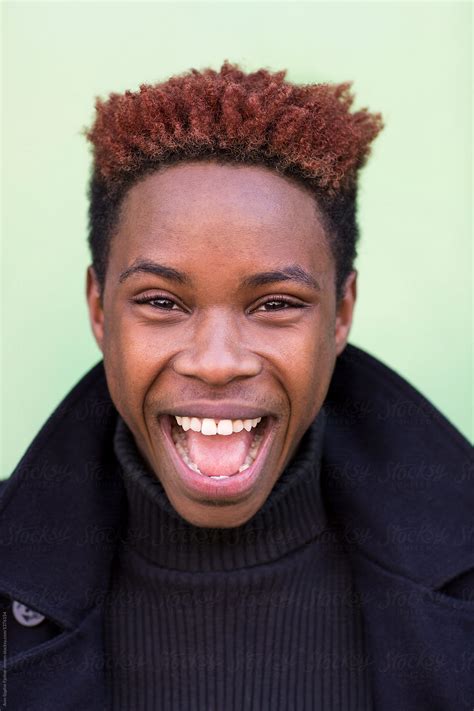 Young Black Man Smiling By Bowery Image Group Inc