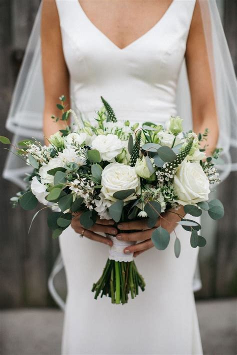 Brown and white wedding bouquet with white roses, pinecones and cotton. 20 Elegant White and Greenery Wedding Bouquets | Pretty ...