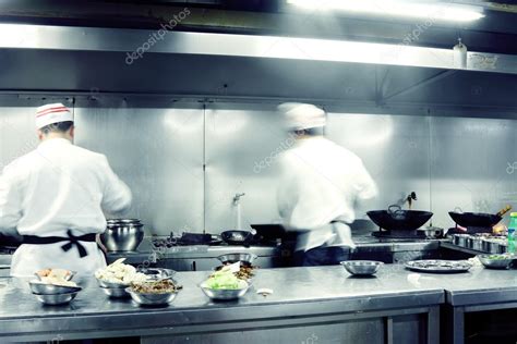 Motion Chefs Of A Restaurant Kitchen Stock Photo By ©snvv 19423699
