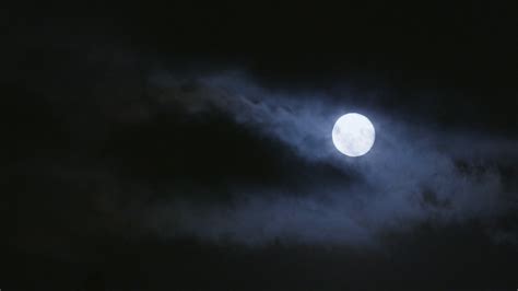 Bright Moon Shining Through Clouds On Dark Night Stock Video Footage