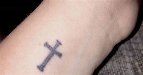 This tiny cross on the wrist can portray your love for christ and is the one for you if you like miniature designs. Cross tattoo on the wrist.
