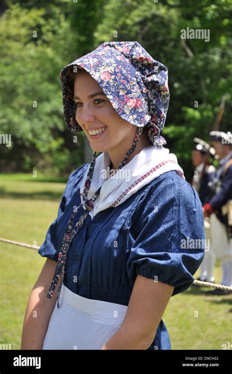 A Young Girl In Period Dress At A Revolutionary War Reenactment Stock