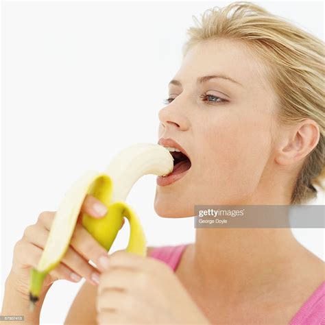 Young Woman Eating A Banana Photo Getty Images