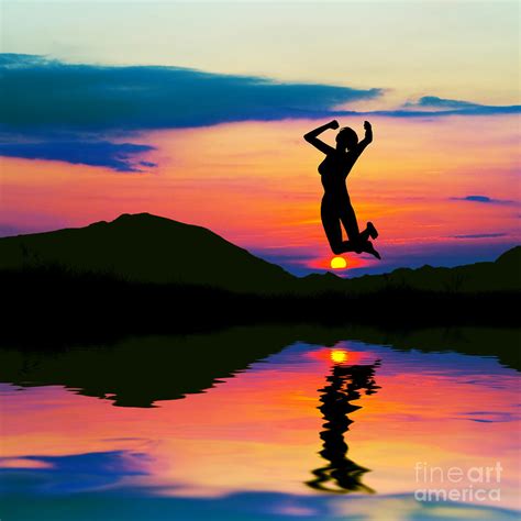 Silhouette Of Happy Woman Jumping At Sunset Photograph By Michal