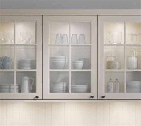 For those that suffer from design restlessness, they're also an easy way to allow for a change of scheme, with quick color changes instantly achieved via dishware or holiday décor. Picture of White Glass Door Kitchen Wall Cabinet | Glass ...