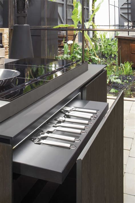 You can order them with 'skins' from the cabinet manufacturer. Natural Skin from Minacciolo - The Kitchen and Bathroom Blog