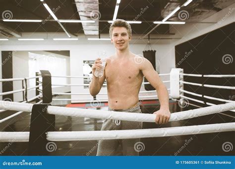 Male Boxer Drinking Water After Fight Or Workout Exercising In Boxing