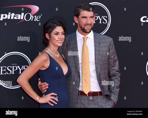 nicole johnson left and michael phelps arrive at the espys at the microsoft theater on