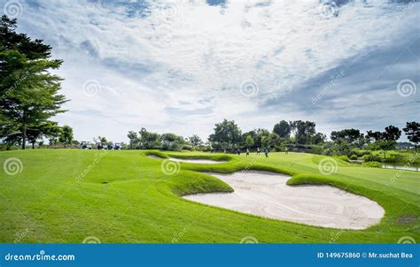 A Beautiful Golf Course Sand Bunker And Green Grass Stock Photo