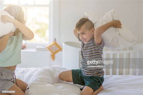 Brother And Sister Having A Pillow Fight In Bed Photos And Premium High Res Pictures Getty Images