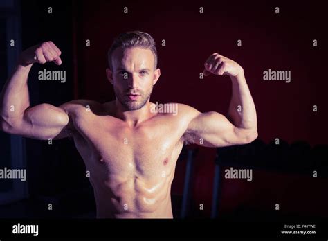 Muscular Man Flexing His Biceps Stock Photo Alamy