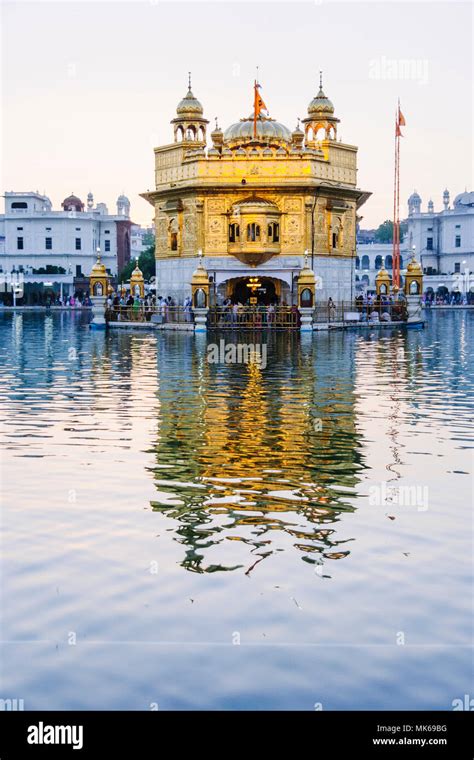 Amritsar Punjab India Golden Temple Reflected On The Surrounding