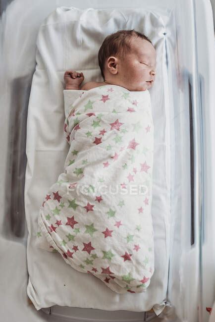 Newborn Baby Boy In Bassinet Wrapped In Hospital Blanket — Heathcare