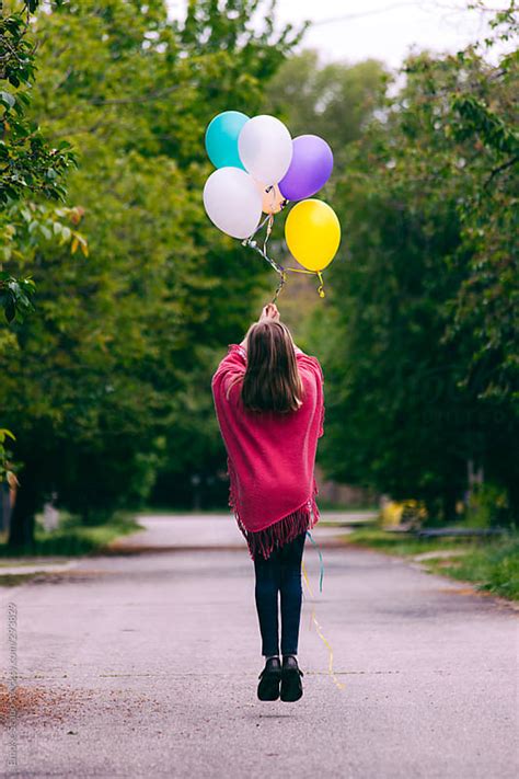 Girl Flying With Balloons By Emoke Szabo Stocksy United