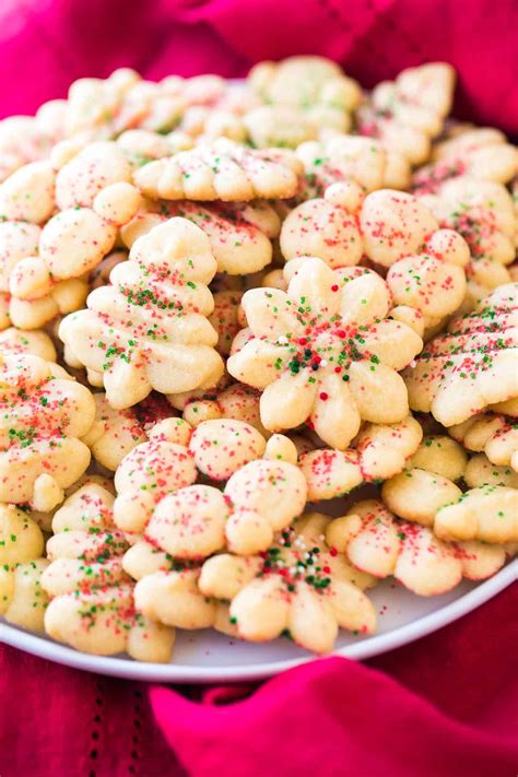 Sprinkle cookies with sea salt flakes and bake for 12 to 14 minutes or until cookies are golden brown. Holiday Spritz Cookies