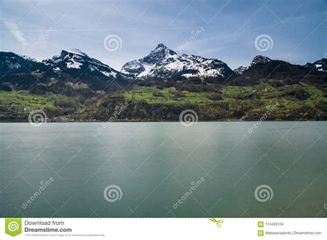 Beautiful Turquoise Mountain Lake Panorama With Snow Covered Peaks And