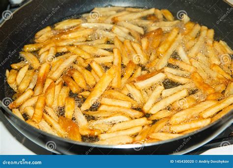 Fried French Fries In A Pan In Sunflower Oil Stock Photo Image Of