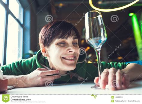 A Drunk Woman Is Sitting At A Table Stock Photo Image Of Headache