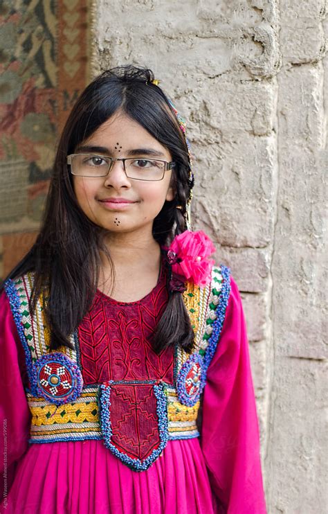 A Baby Girl In Ethnic Balochi Dress And Eye Glasses By Stocksy