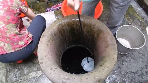 Wash light colored clothes in hot water with a warm or cold rinse. Shexian China - Women washing clothes with well-water ...