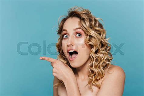 Beauty Image Of Young Half Naked Woman Expressing Surprise And Pointing Finger At Copyspace