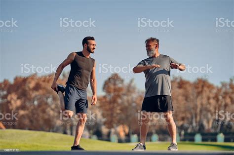 The Young And Old Athletes Stretching Outdoor Stock Image Everypixel