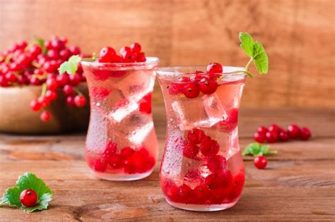 Premium Photo Cold Compote With Ice Cubes From Fresh Red Currant Berries Boiled Redcurrant Juice