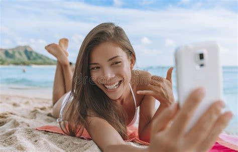 Hawaii Waikiki Beach Vacation Asian Bikini Model Woman Taking Selfie With Mobile Photo Lying