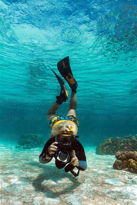 Woman Taking Photos Underwater By Stocksy Contributor Jovana Milanko Stocksy