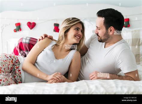 Young Couple Having Romantic Time In Bedroom Stock Photo Alamy
