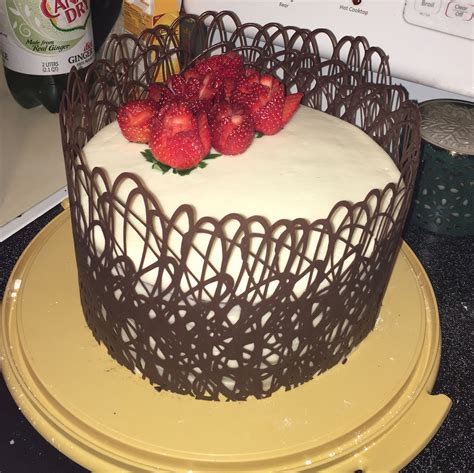 It's frosted with classic ermine icing and gets its red color from beets. Red velvet cake with cream cheese icing, decorated with chocolate lace and strawberry roses ...