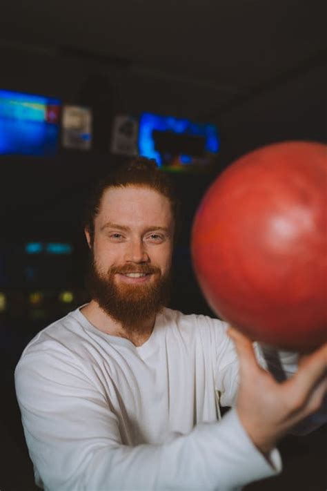 A Man Holding A Bowling Ball · Free Stock Photo