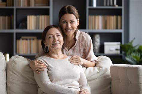 Portrait Of Adult Mom And Daughter Relax On Couch Stock Image Image